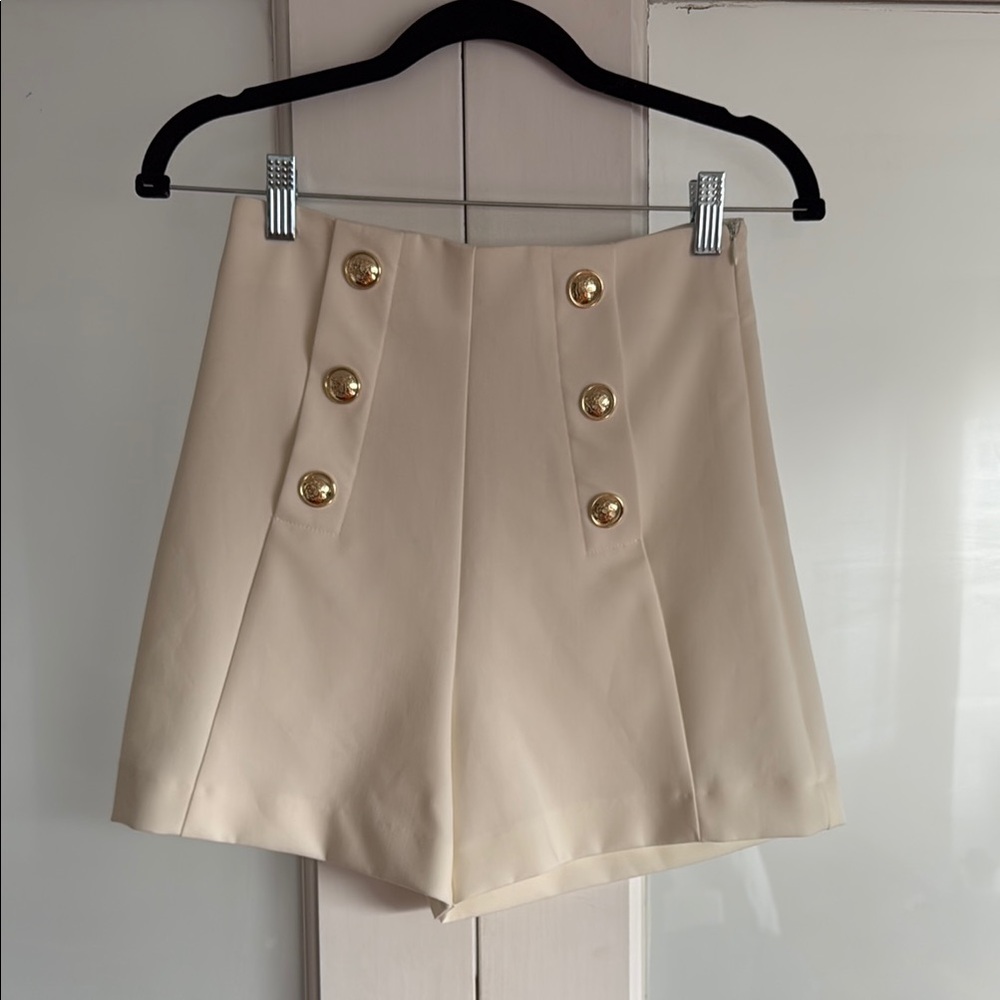 Elegant Cream Women's Shorts with Gold Buttons